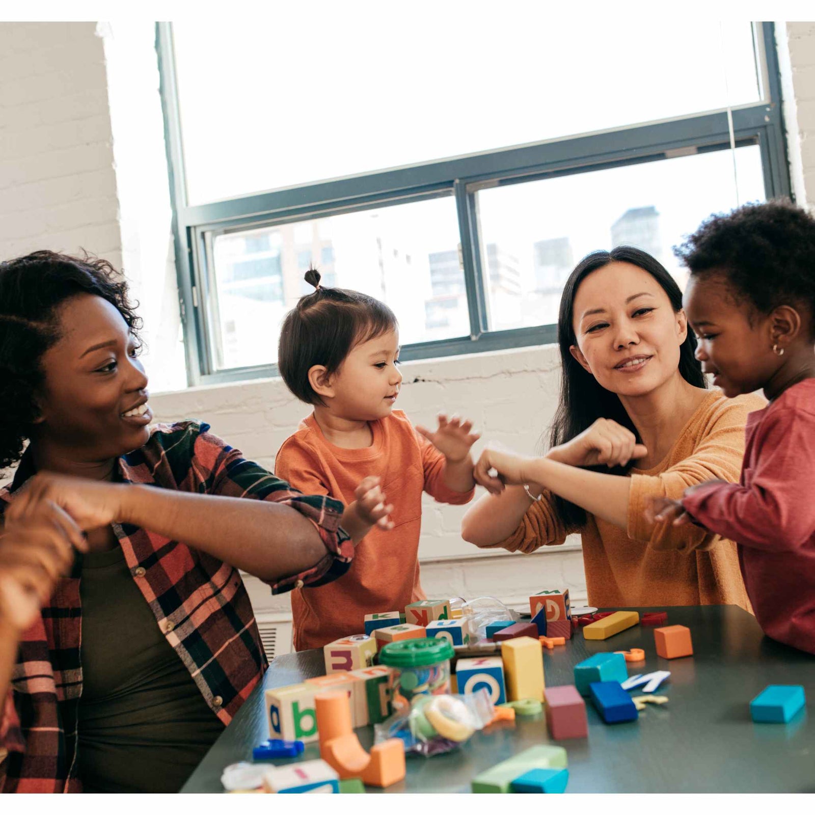 moms and kids playing
