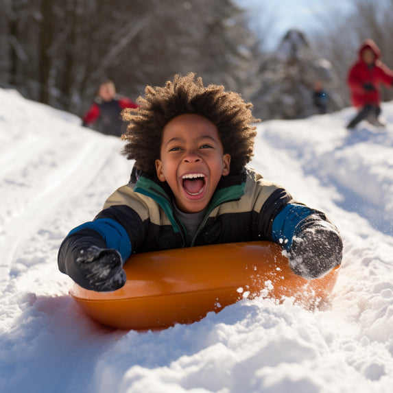 happy kid snow tubing