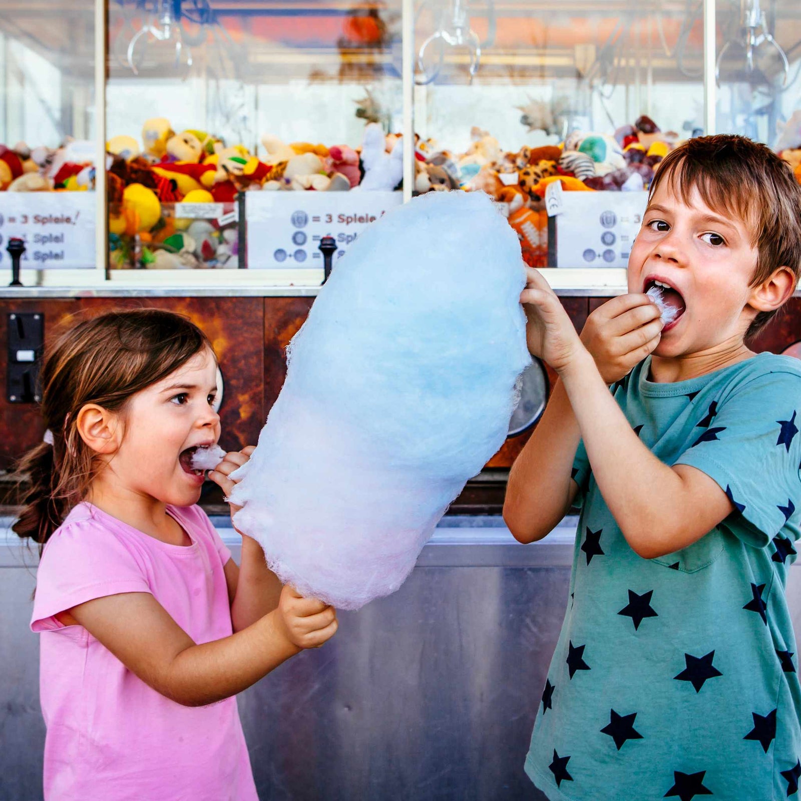 kids eating a large cotton candy