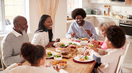 Multi-generational family gathered around dinner table