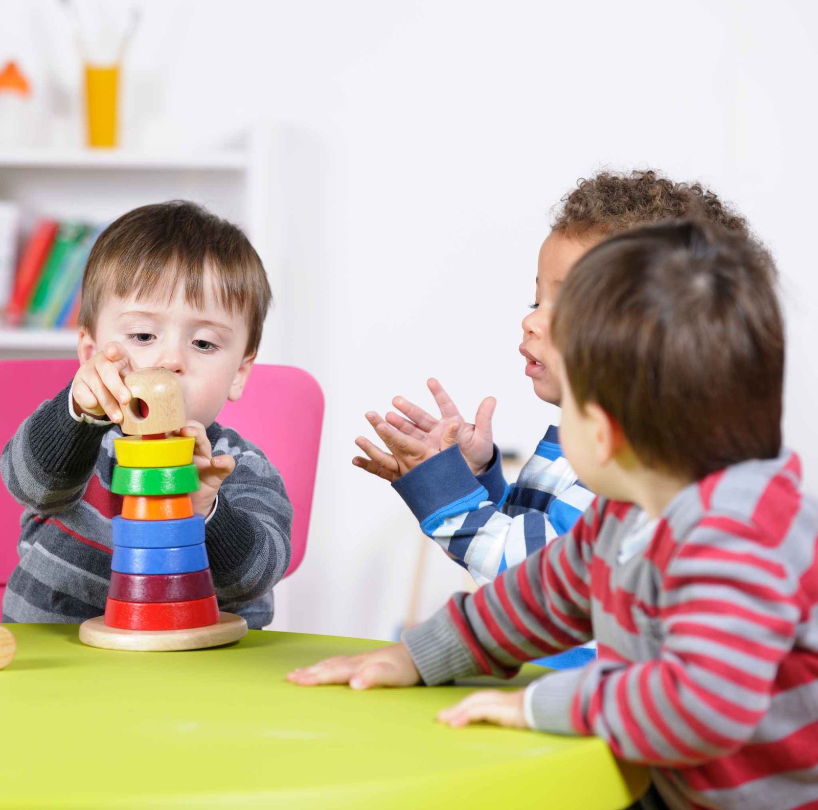 kids playing with stacking rings