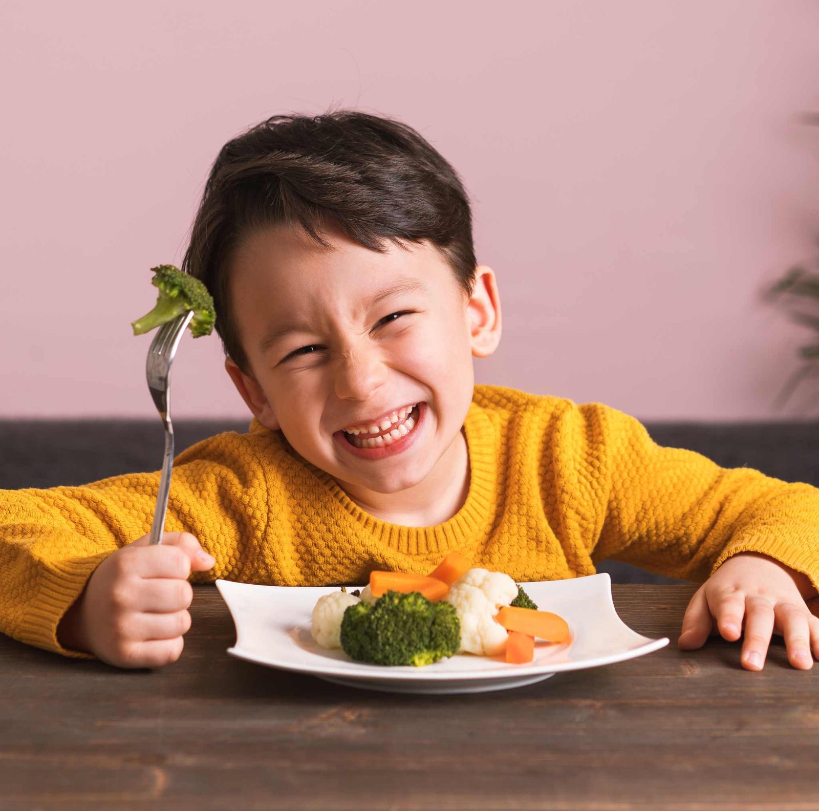 kid enjoying eating vegetables