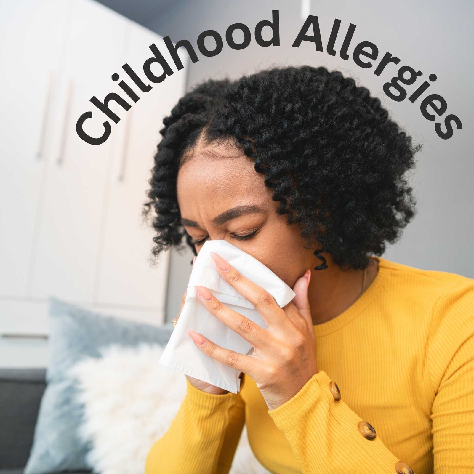 childhood allergies, girl sneezing into tissue