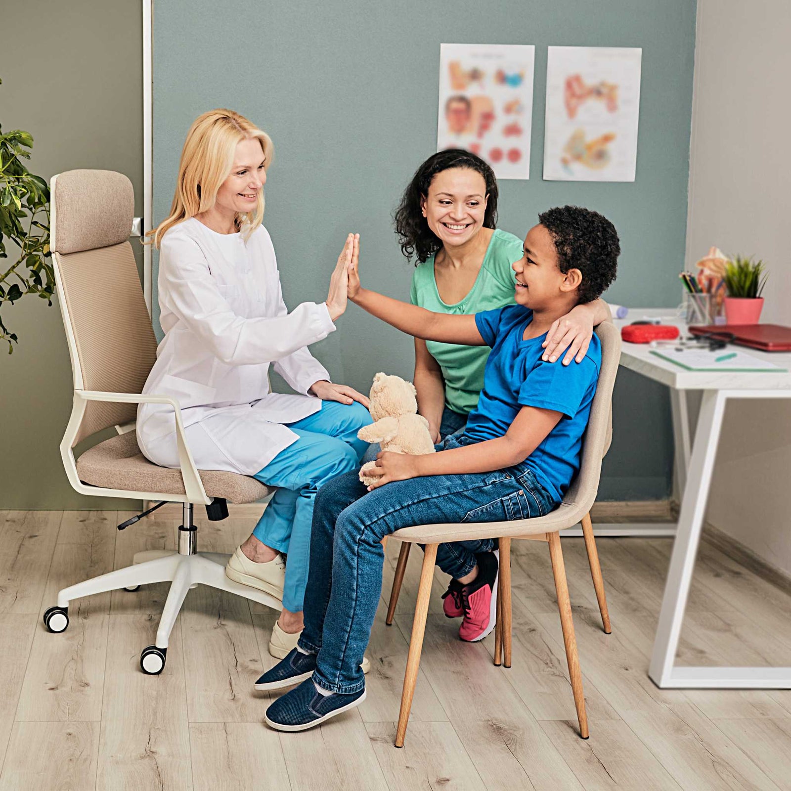 child and mother meeting with doctor