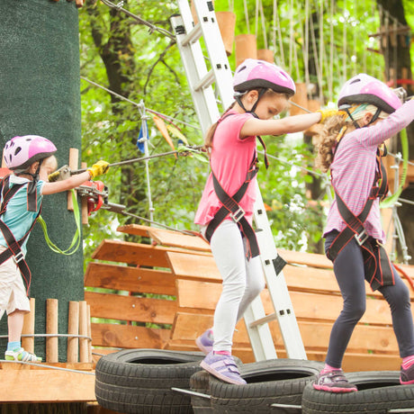 kids navigating an outdoor obstacle course