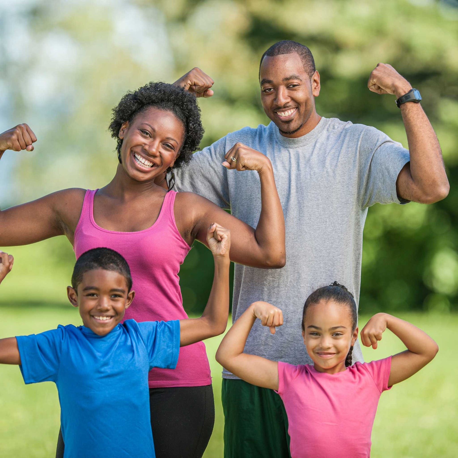 family showing their bicep muscles