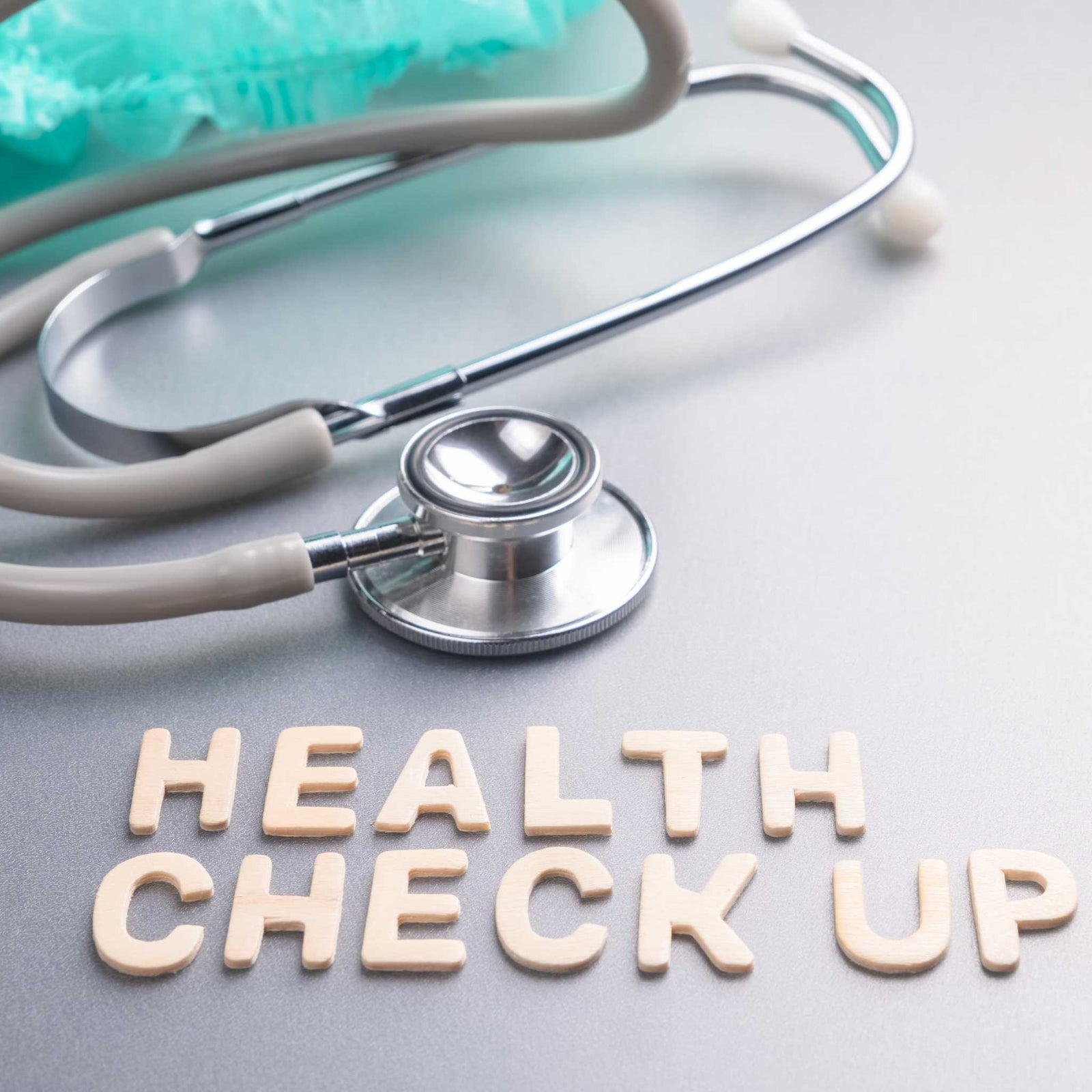 the words "health check up" next to stethoscope  