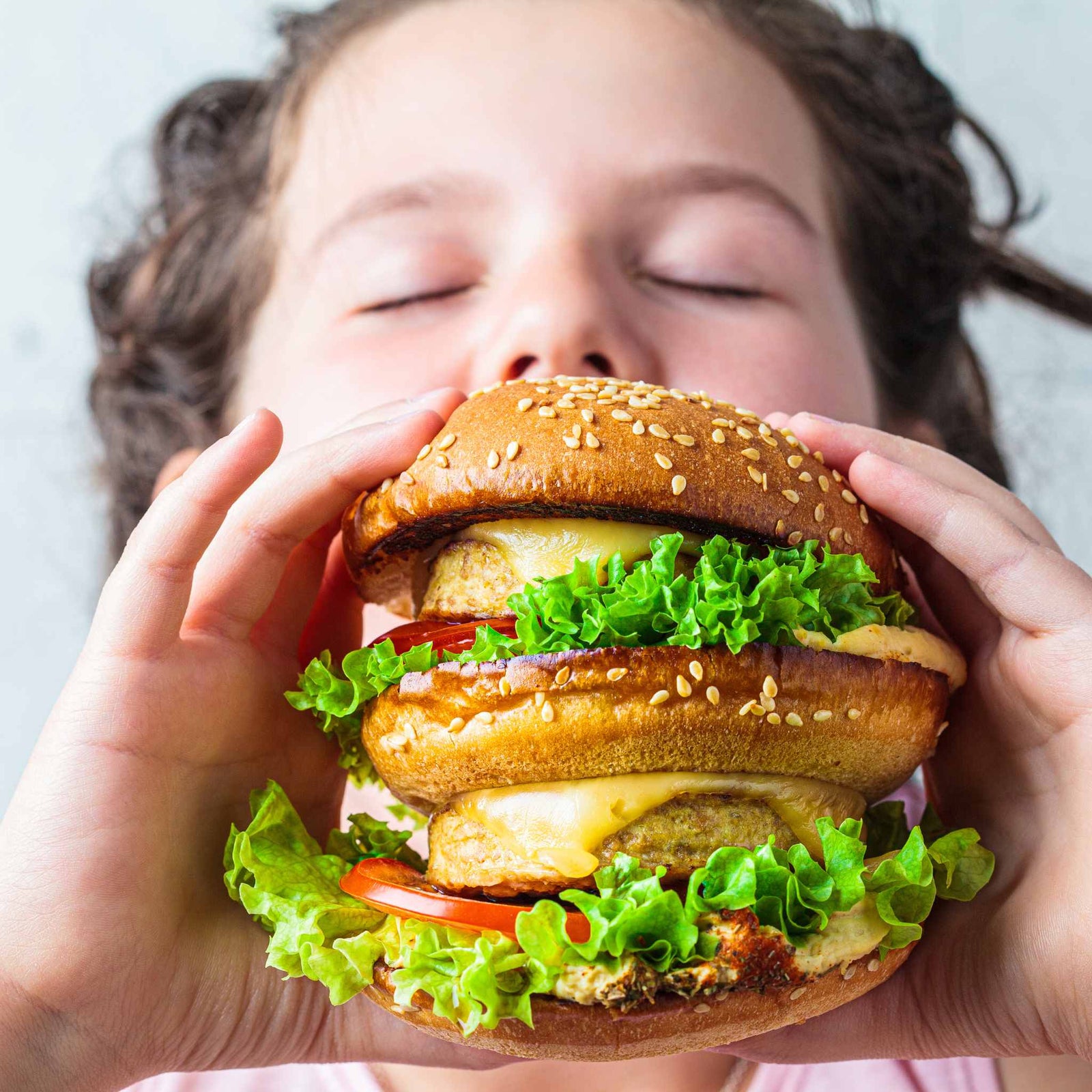 kid eating a veggie burger