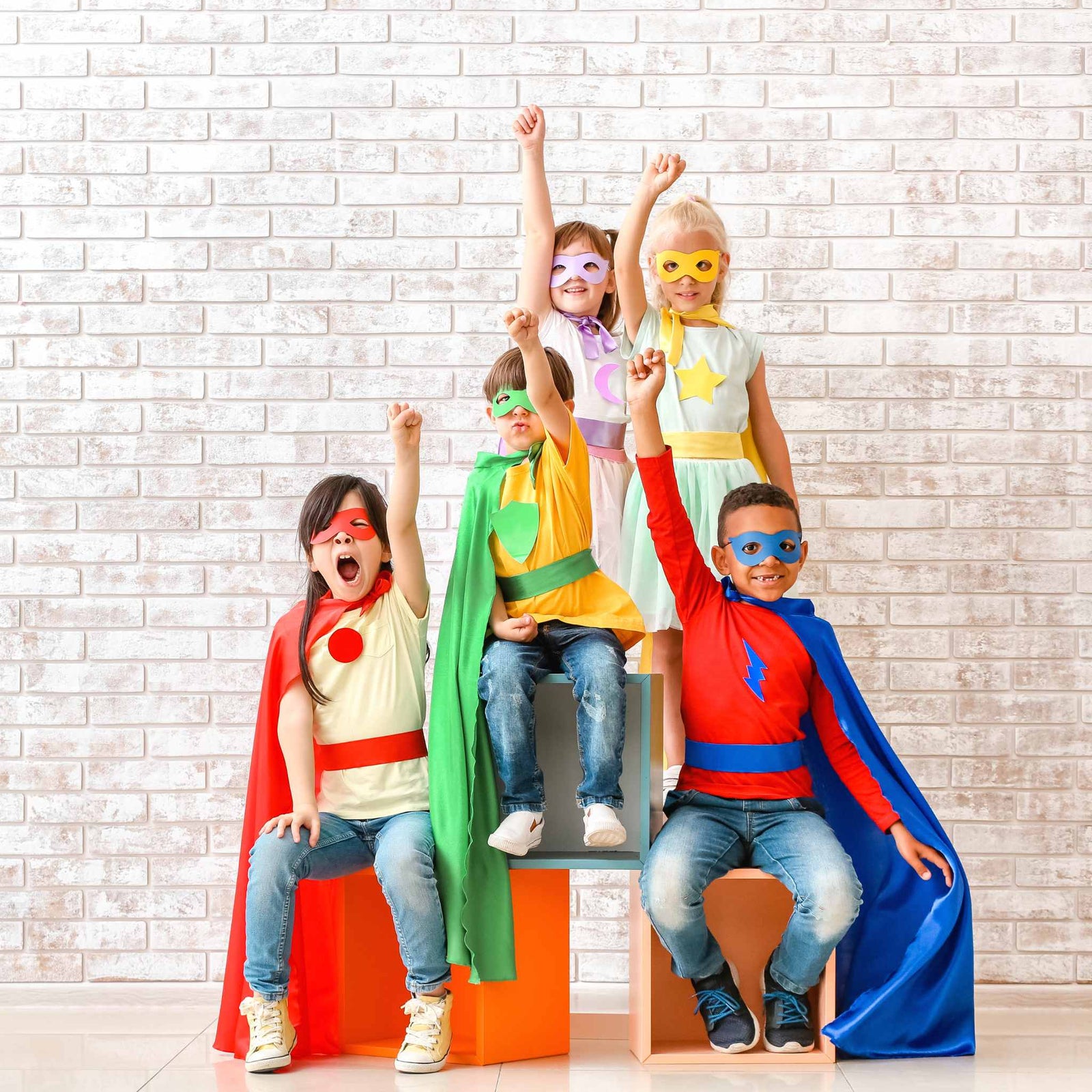 kids dressed up as superheros