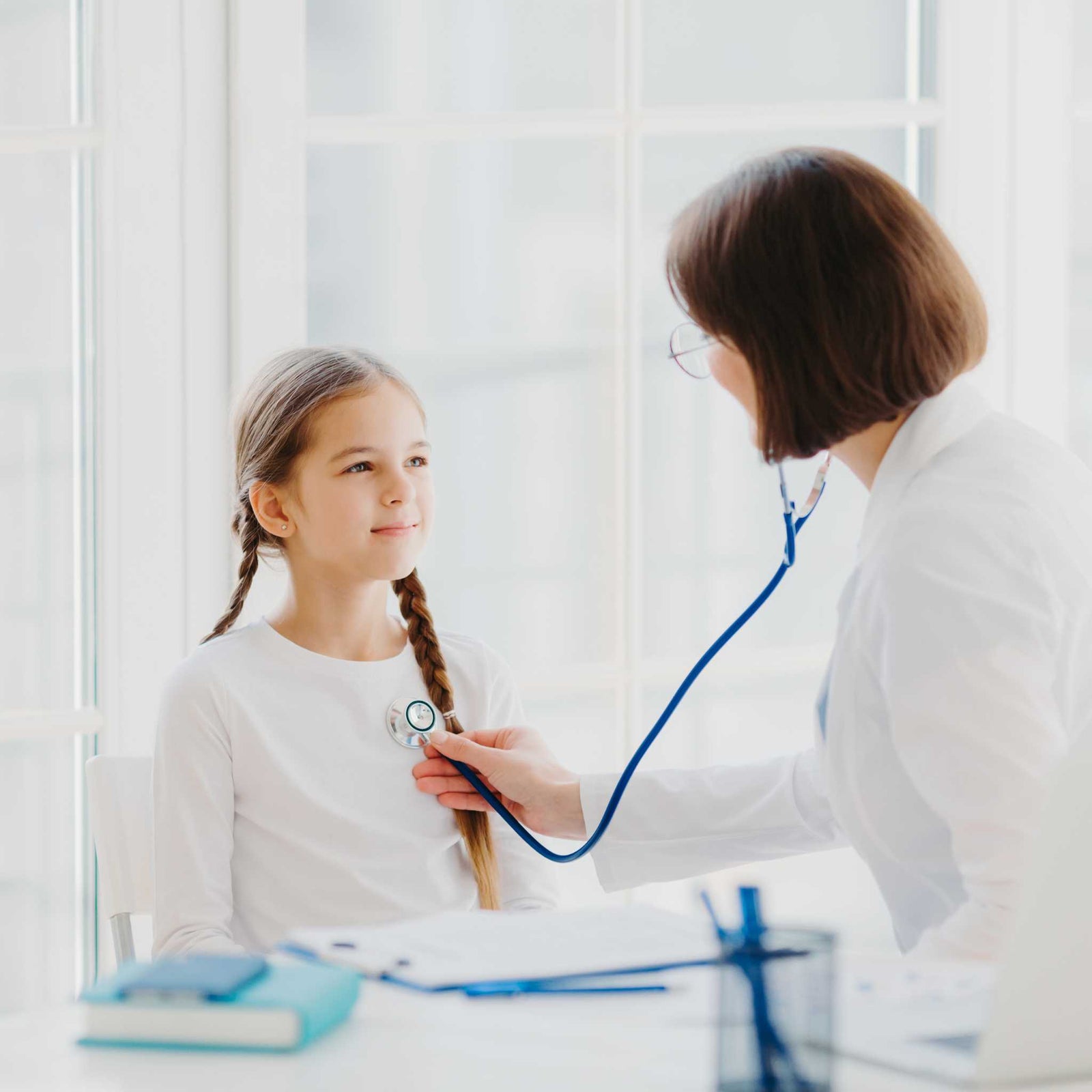 child and pediatrician with stethoscope