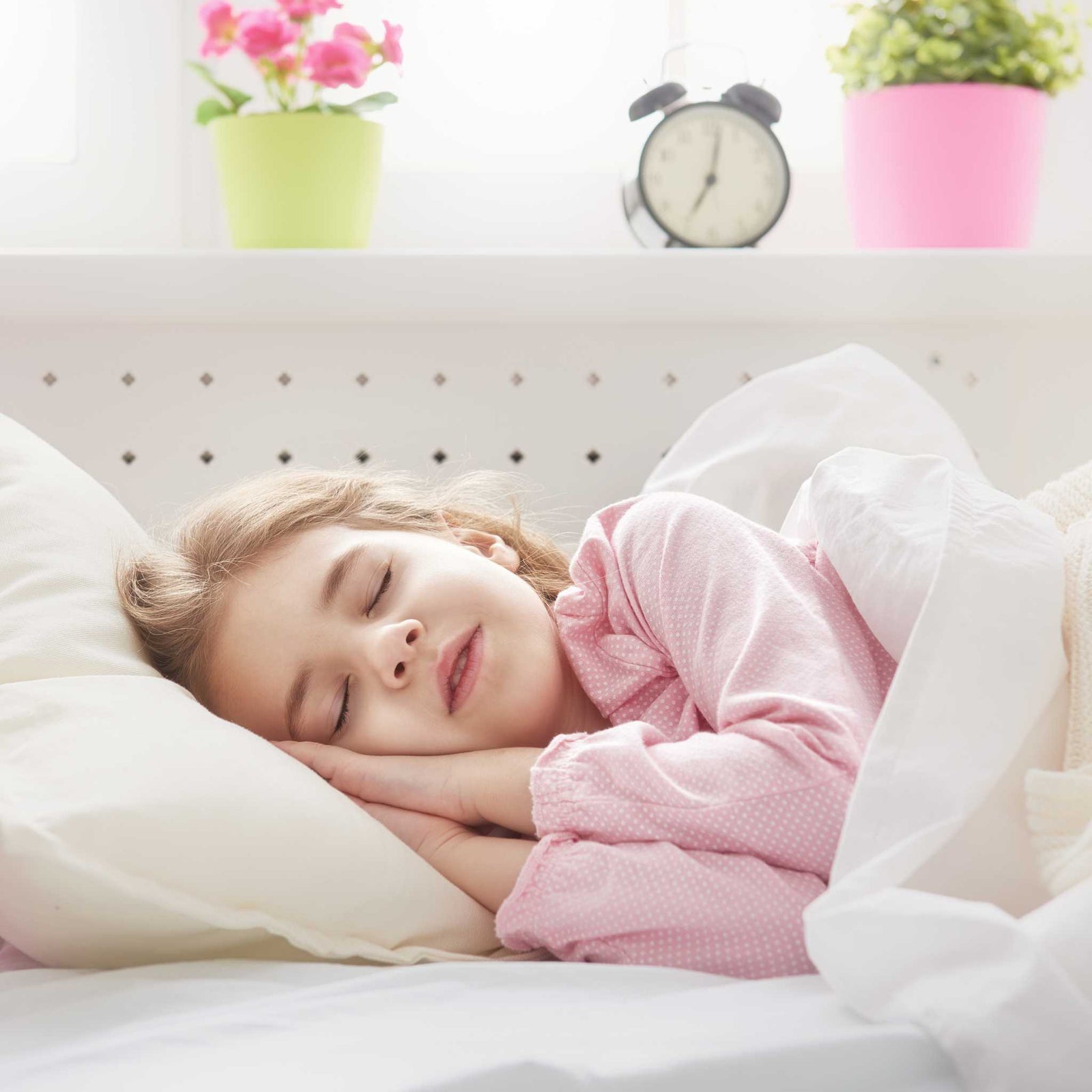 child sleeping in the bed