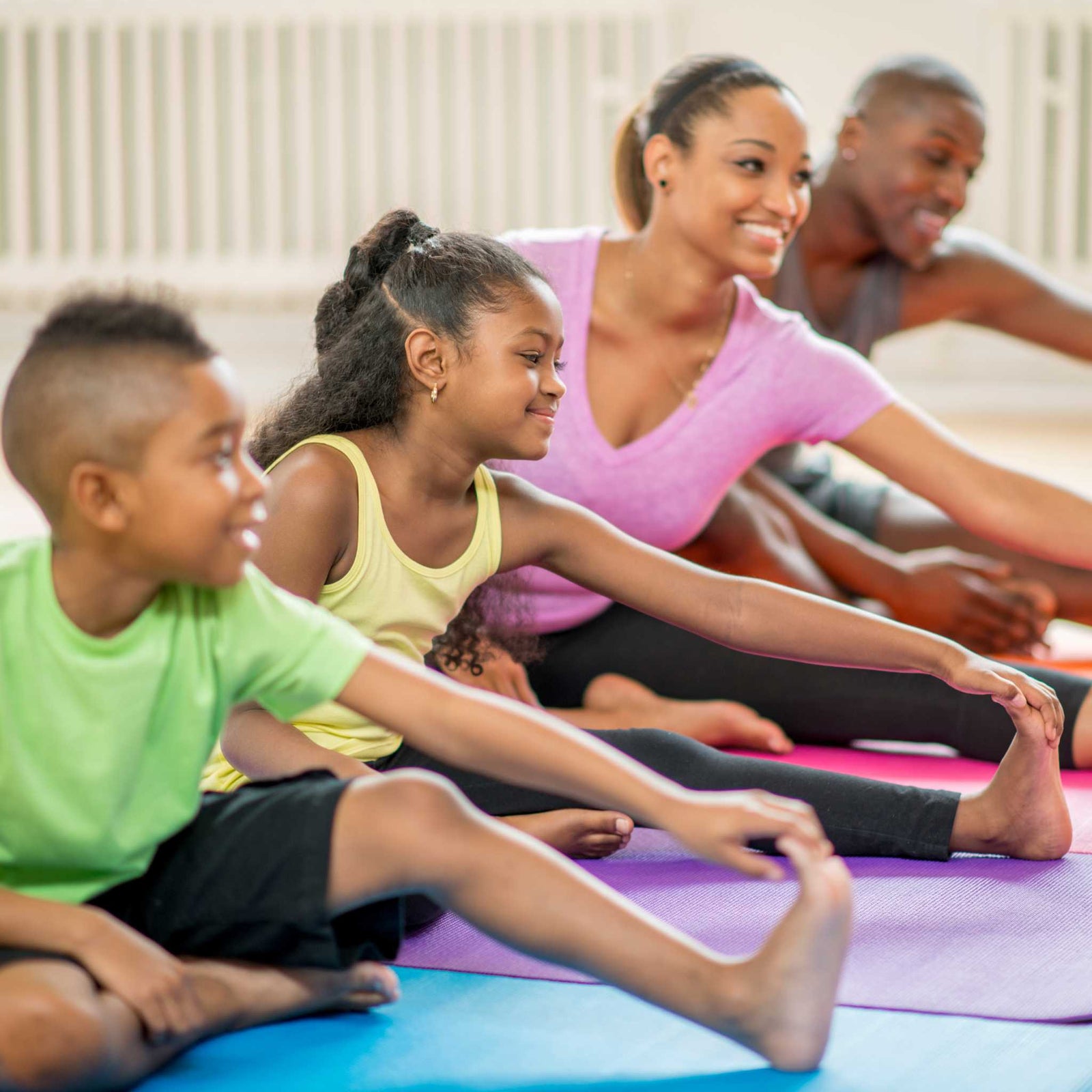 family doing yoga together