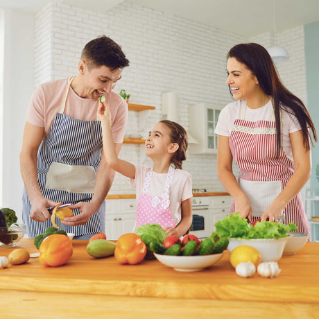 family prepping fresh vegetables