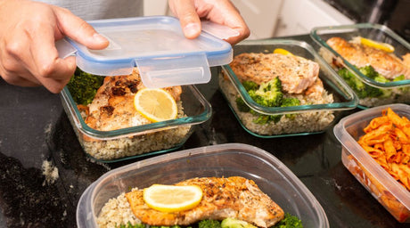 meal prepping in glass storage containers
