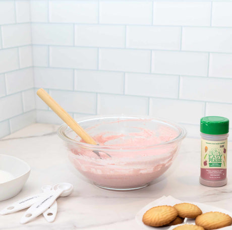 Easy Peasie Red Blend veggie powder being used to in cooking frosting