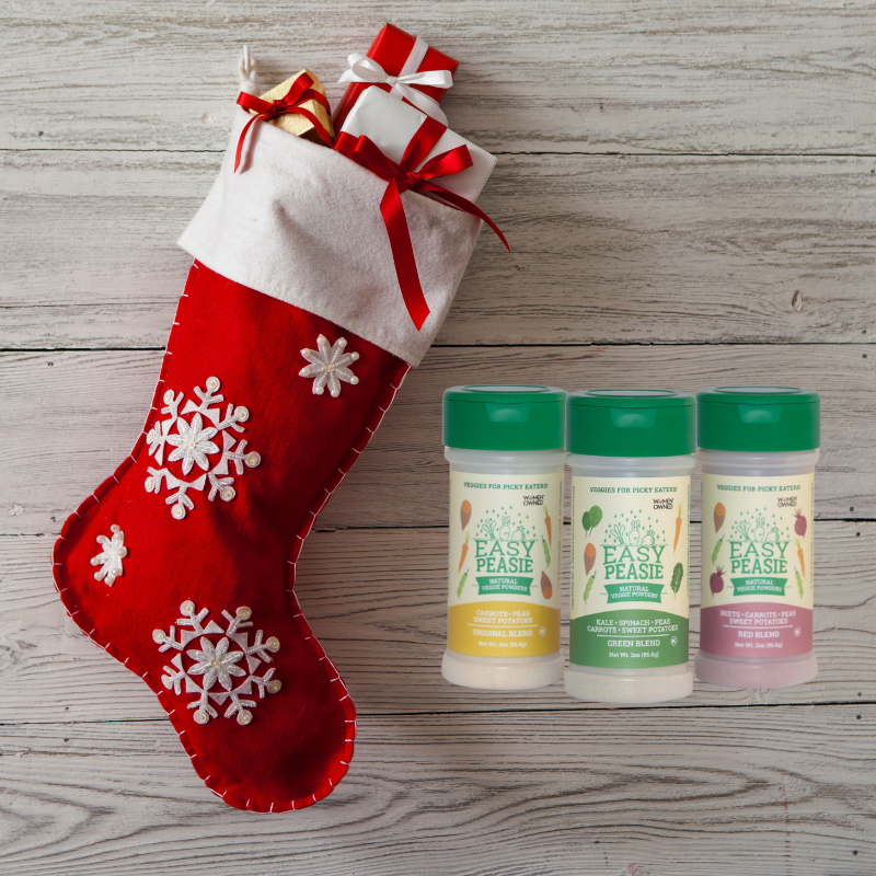 3-pack of Easy Peasie veggie powder jars next to a Christmas stocking